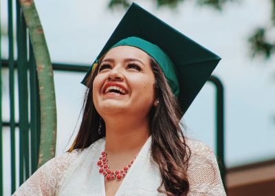 Photo of student smiling after graduation